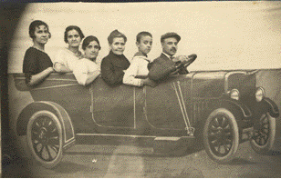 The Badia family in a paper car